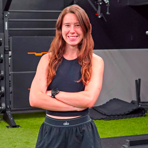 jessica brown posing for a photo in the speed strength academy studio at dedham health